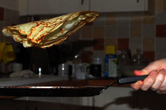 A pancake being tossed.