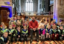 Youngsters try out vicar’s pulpit on church visit