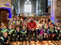 Youngsters try out vicar’s pulpit on church visit