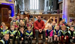 Youngsters try out vicar’s pulpit on church visit