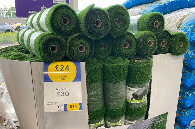 Rolls of artificial grass for sale in Tesco.