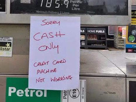 A written notice which reads: “Sorry CASH ONLY credit card machine not working.”
