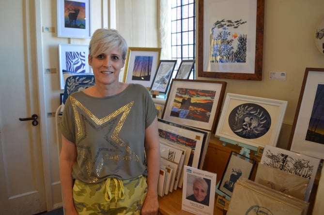 Tara Slater with her works at the Private View exhibition