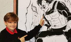 Aspiring anime artist show’s off ink drawing as big as he is
