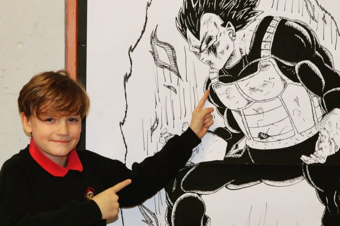 George (Year 7) pointing to his drawing of Vegata from Dragon Ball Z
