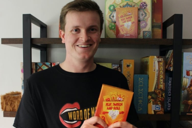 Dexter Churchus with his game Flip, Switch, and Roll