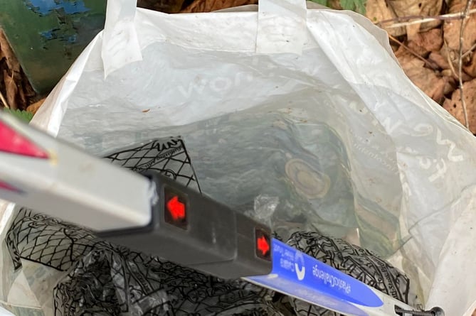 A bag full of singe-use plastic glove bags collected from the brook by Morrisons