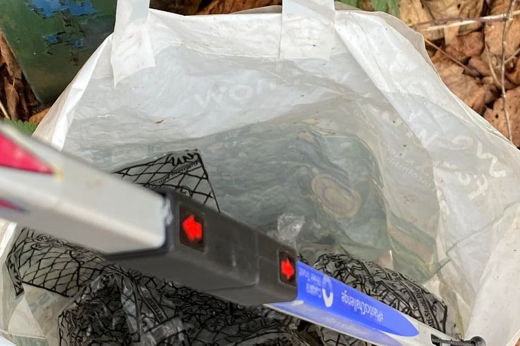 A bag full of singe-use plastic glove bags collected from the brook by Morrisons