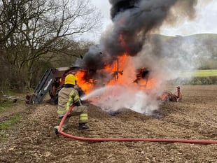 Fire crew takes on flaming tractor