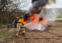 Fire crew takes on flaming tractor