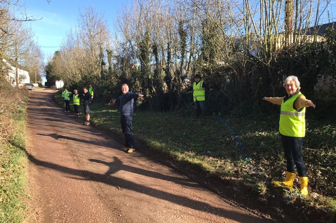 Brampton Abbotts residents demonstrating the size of the passing bay