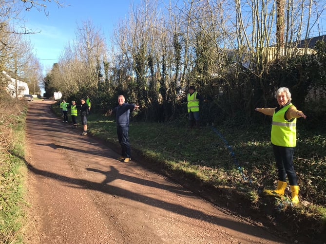 Brampton Abbotts residents demonstrating the size of the passing bay