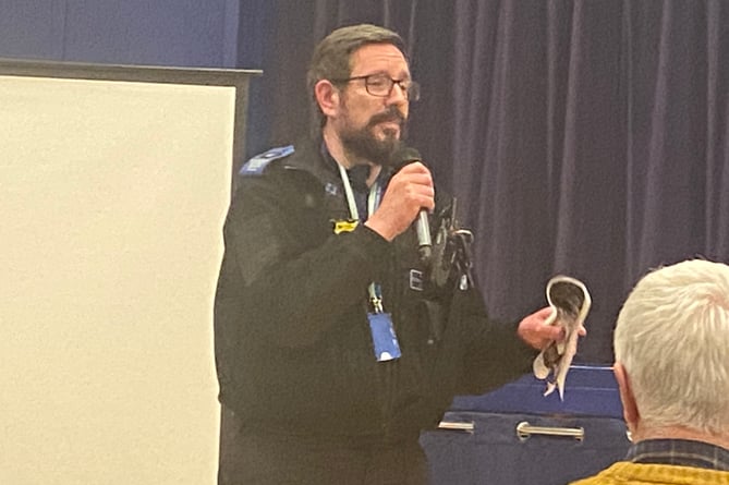 PCSO Simon Hall speaking in front of the Ross Parish SGM