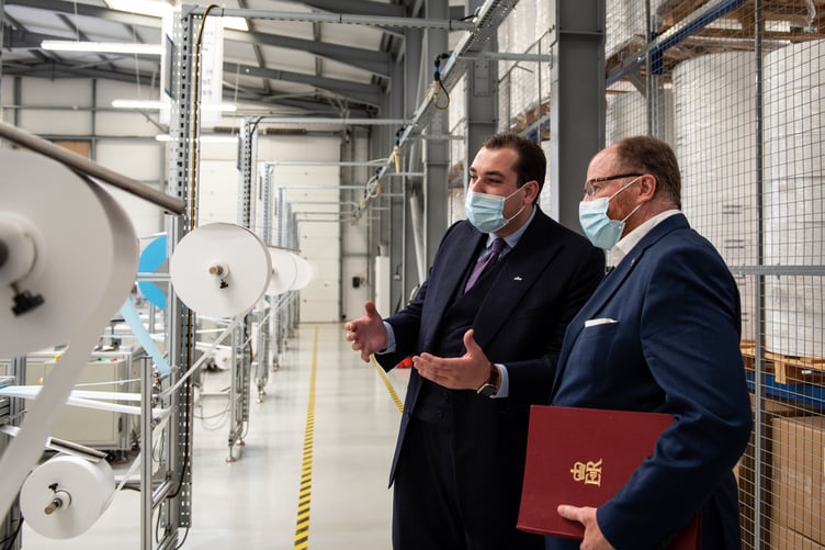 Dustin Kronsbein (Left) MD of Ultrafilter shows Minister for Science, Research and Innovation George Freeman MP Ultrafilter's face mask production line