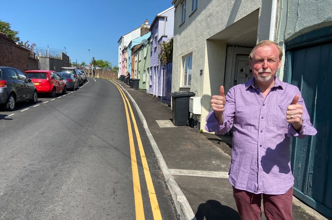 Cllr Louis Stark next to the newly resurfaced Kyrle Street