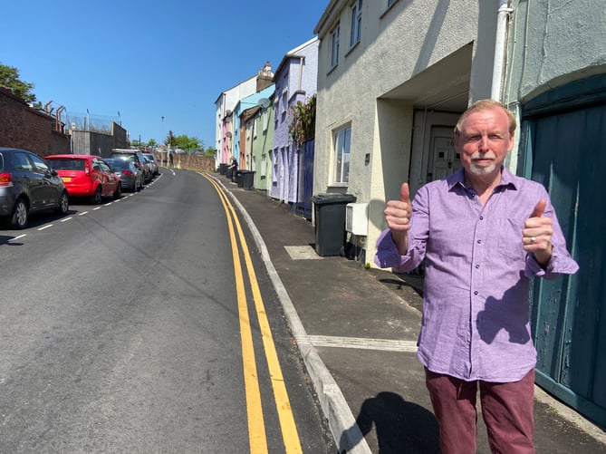 Cllr Louis Stark next to the newly resurfaced Kyrle Street