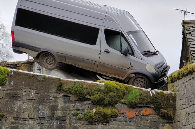 An AI depiction of a van crashing into the barrier of a stone bridge
