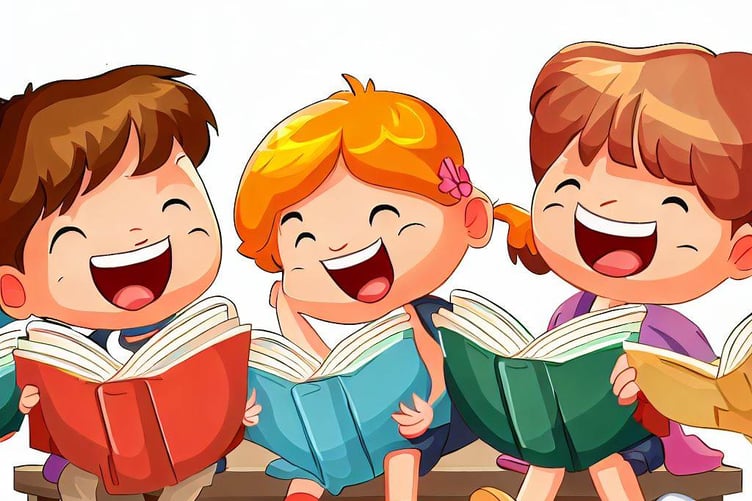 Children smiling whilst reading