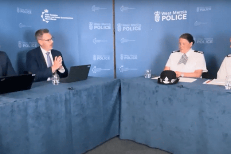 PCC John Campion sitting on a panel with several other people from West Mercia Police and his deputy