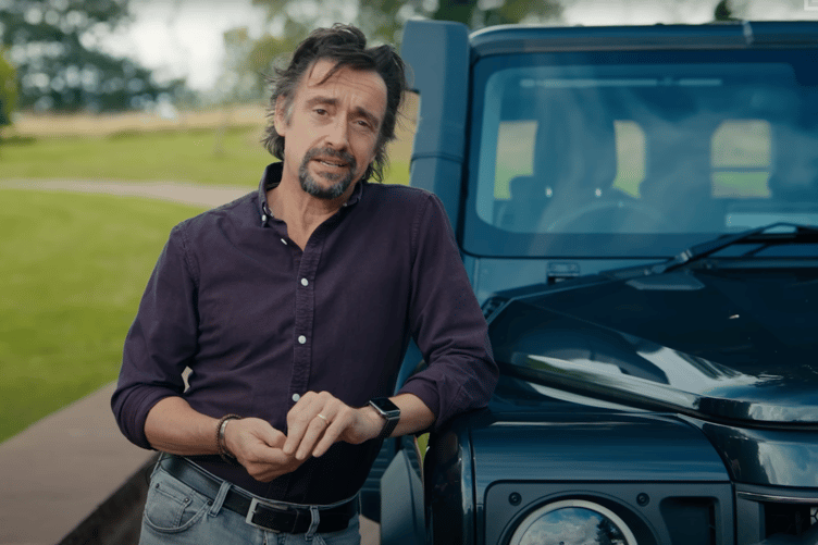 Richard Hammond leaning on a Land Rover