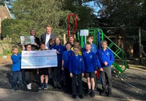 School 'so grateful' to village garage after playground donation
