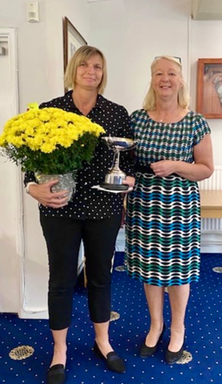 Kerry Welding is presented with the Josie Powell Trophy from Ross-on-Wye GC ladies captain Katie Stooke