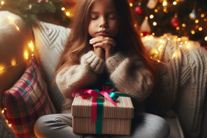 Child receiving Christmas gift