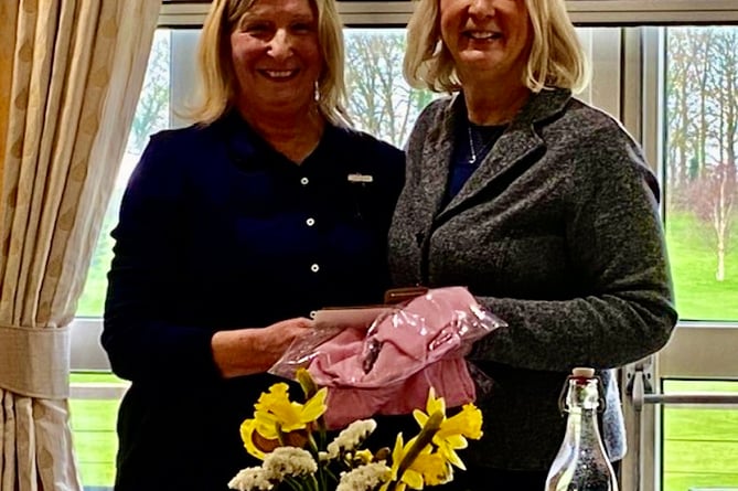 ast year’s Lady Captain Katie Stooke (right) welcoming the incoming Lady Captain Lorraine Fenner (left