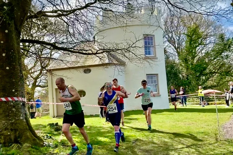 Spirit runner Vicky Roberts gives a thumbs up as she passes the Round House.jpg