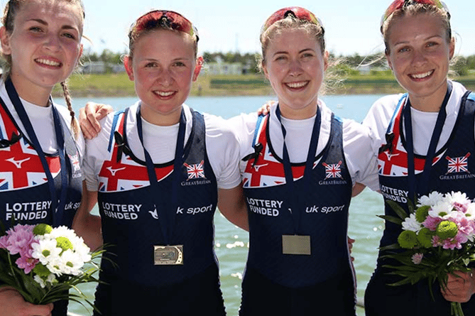 Mathilda, second from right, with her world medal boat in 2017