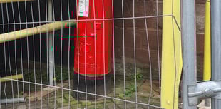 Building work puts postbox behind bars