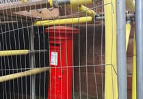 Building work puts postbox behind bars