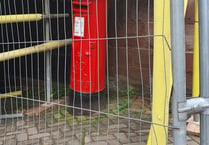 Building work puts postbox behind bars