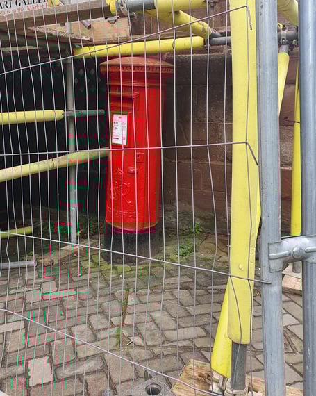 Postbox behind bars