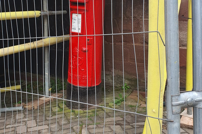 Postbox behind bars