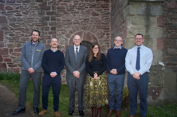 Phil Davis of the project committee and architect Deborah Johnson (centre) with contractors Phillip Illig, Adam Klups, Simon Ridley and Matthew Dyke