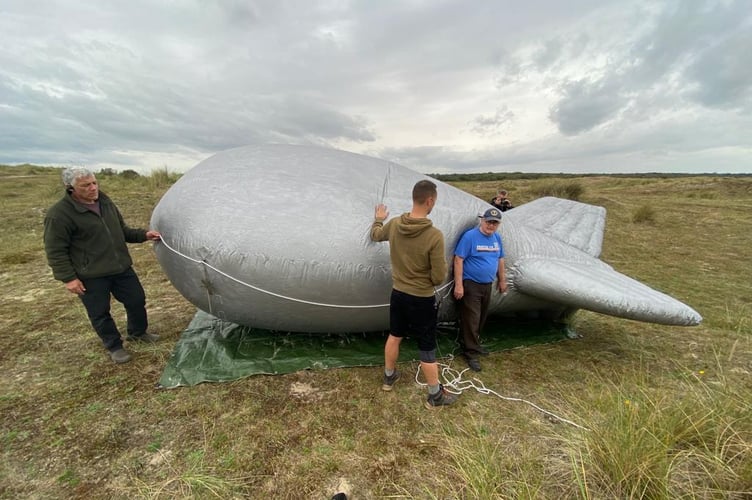 Pete Garwood with the crew on "Erased"-" we used this balloon on the beach in the film."