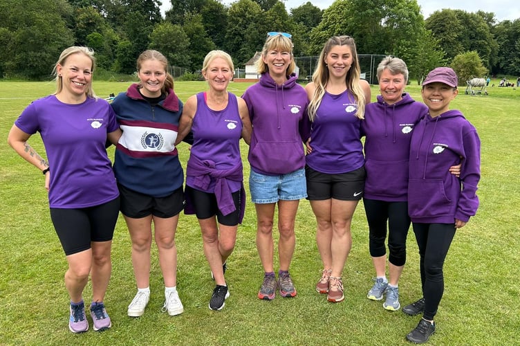 The Ross Runners, resplendent in their purple strip