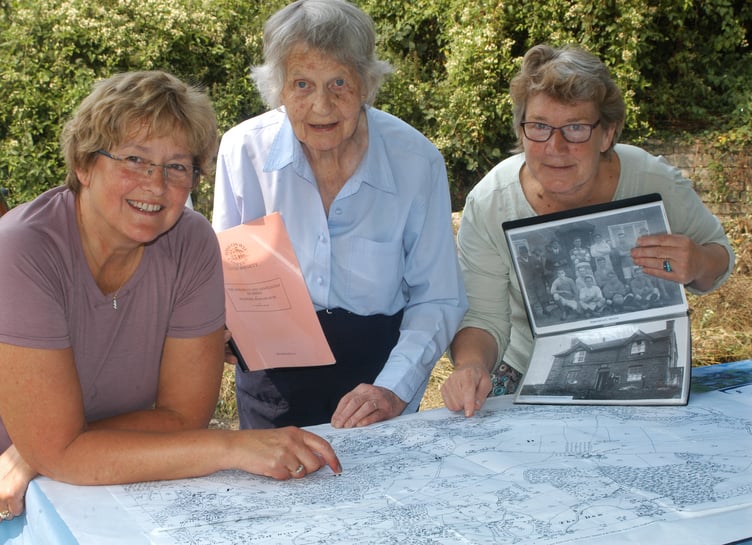 Three women and old map