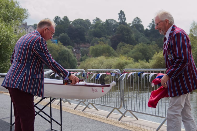 Torsten Pope, left, and Jeremy Picton-Turbervill bless the new boat 'Rosie' at the top of the rebuilt steps. Photo: Imogen Bell