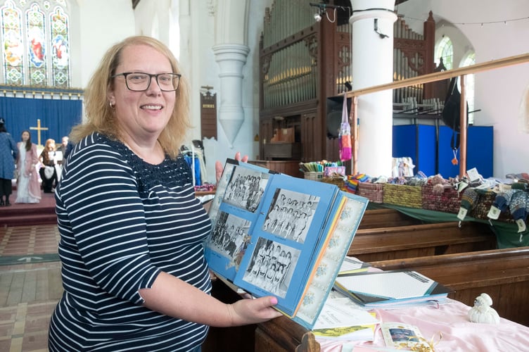 Nicola Jones with a photo album from The Wesley Players' 1987 panto Ali Baba in which she appeared.