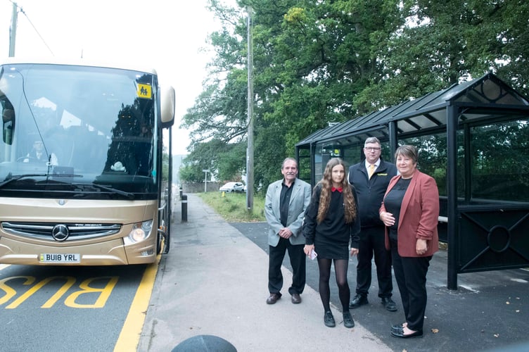Ava Davis with Cinderford Town Council chairman Cllr Graham Morgan, Tom Grindle of Grindle's Coaches and town council assistant clerk Annie Weyman.