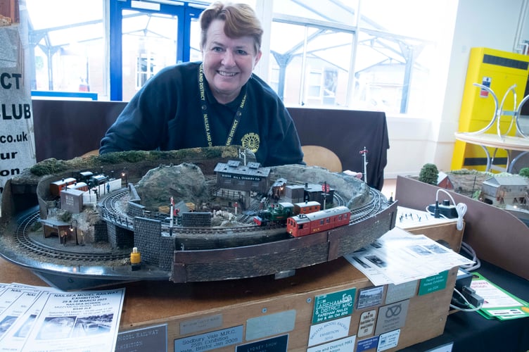 Heather Hatch with a layout created by her father 60 years ago.