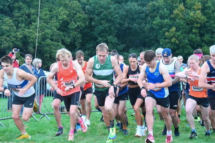 Liam Trigg in the green of the Forest of Dean Athletic Club at the start of the half marathon.