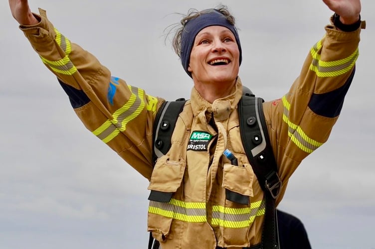 George Gilbert salutes after completing her epic marathon challenge 