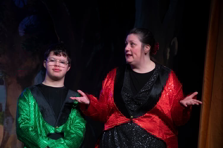 Matthew Bullen as Buttons the Page and Rhiannon Lewis as Bows the Butler.