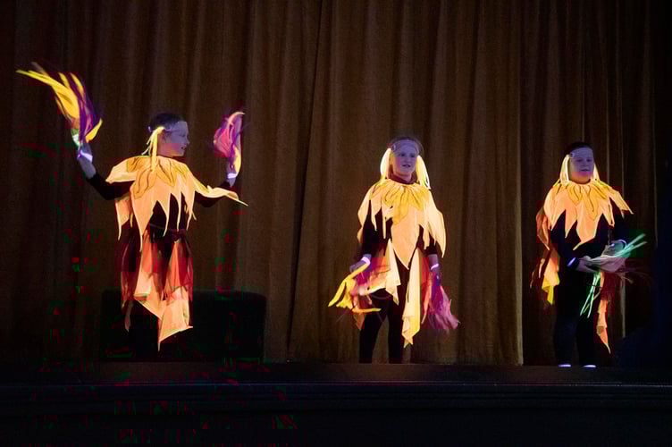 A dance that sets the stage aglow.