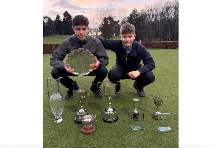 Aidan and Ollie Evans with their trophies won during 2024. Photo: Ross Golf Club