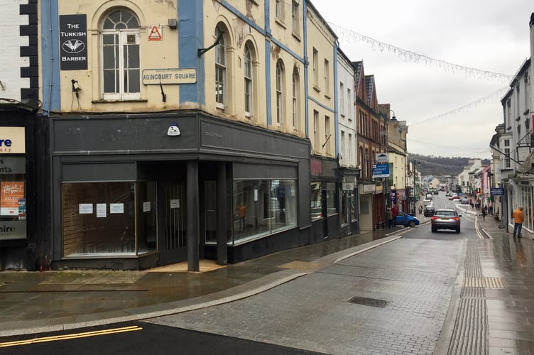 The building, seen during the planning battle, occupies a prime spot on the corner of Monnow Street and Agincourt Square