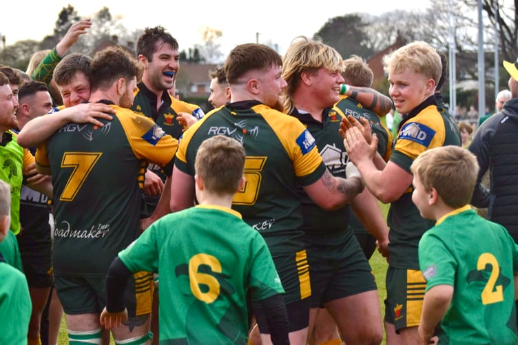 Newent players celebrate after the title-winning victory over Cheltenham. Picture: Georgina Gardner.